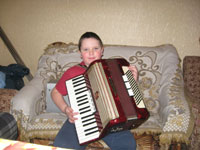 DIMA PERFORMING ON HIS ACCORDIAN